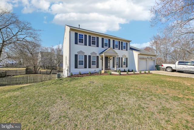 colonial house featuring a garage, a front lawn, driveway, and fence