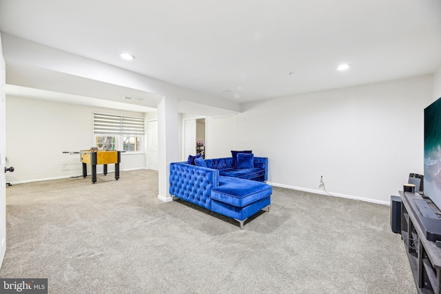 living area with recessed lighting, visible vents, baseboards, and carpet flooring