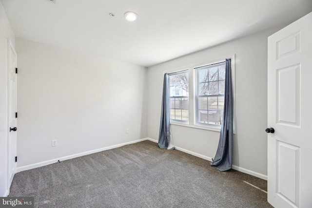 unfurnished bedroom with baseboards and carpet flooring