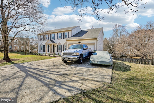 colonial home featuring a front lawn, fence, concrete driveway, an attached garage, and a chimney