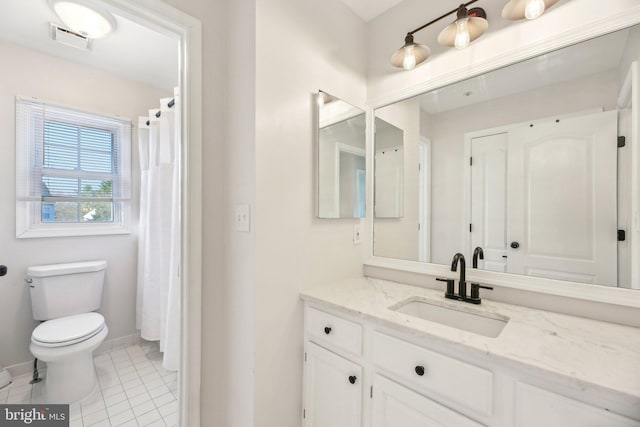 full bathroom featuring vanity, baseboards, visible vents, tile patterned floors, and toilet