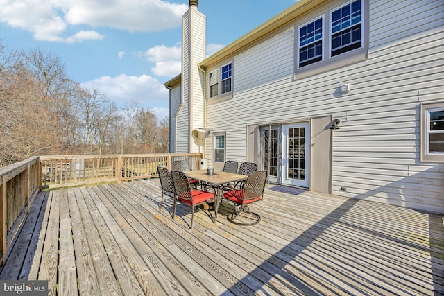 wooden deck with outdoor dining space