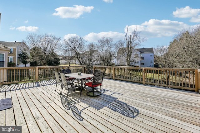 deck with outdoor dining area