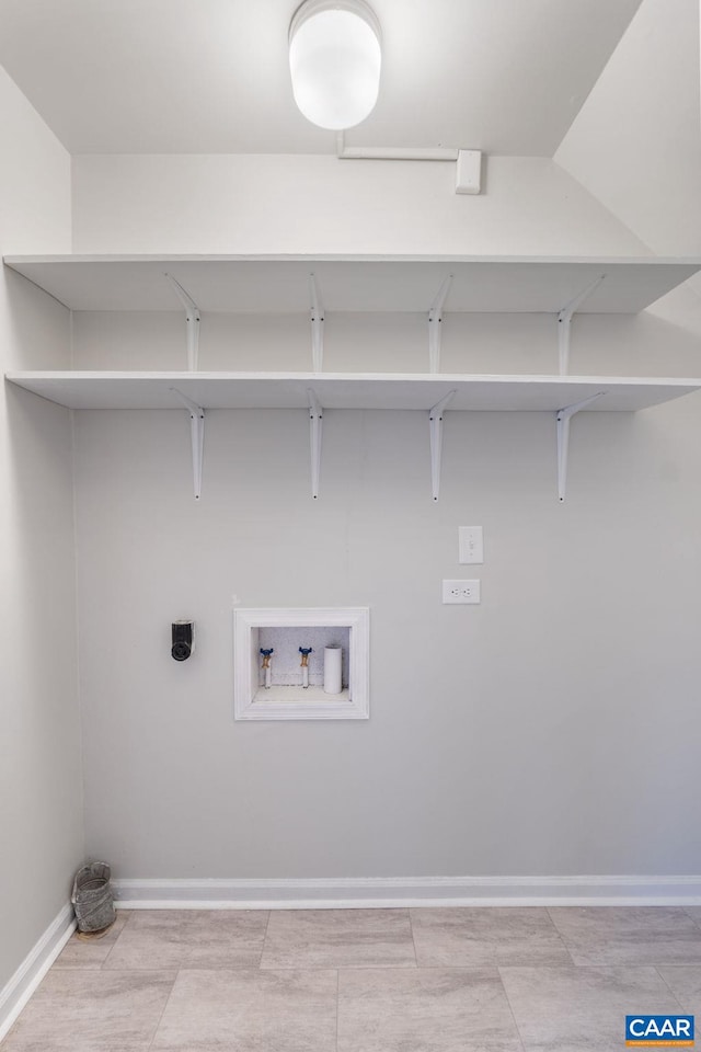 clothes washing area featuring laundry area, electric dryer hookup, baseboards, and washer hookup