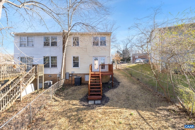 rear view of house with stairway, cooling unit, a deck, and fence