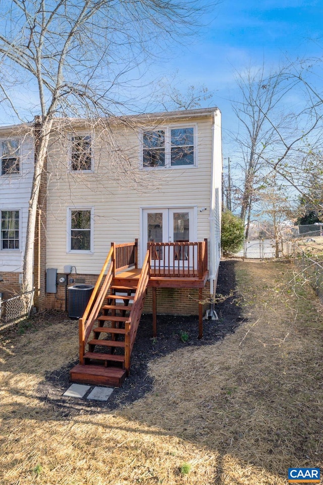 back of property with stairway, central air condition unit, fence, and a wooden deck