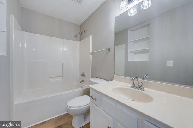 full bath featuring vanity, wood finished floors, visible vents,  shower combination, and toilet