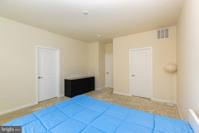 bedroom featuring visible vents, carpet flooring, and baseboards