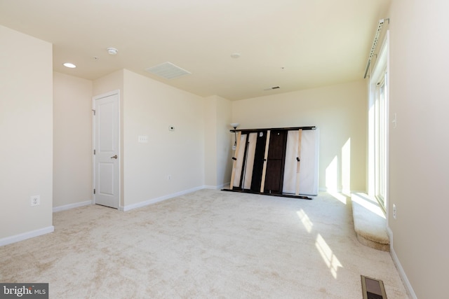 unfurnished room with recessed lighting, baseboards, visible vents, and carpet floors