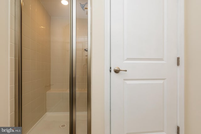 full bath with a shower stall