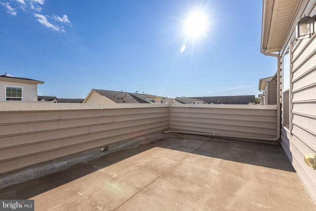 view of patio featuring a balcony