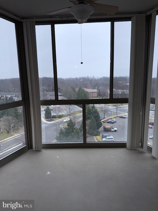 room details featuring concrete floors and a ceiling fan