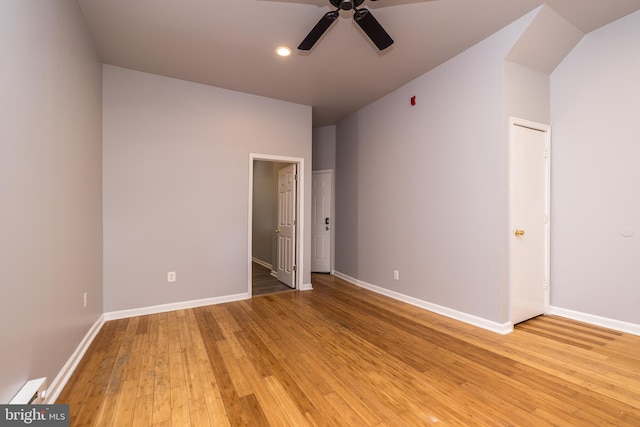 interior space featuring recessed lighting, light wood-style floors, a baseboard radiator, baseboards, and ceiling fan