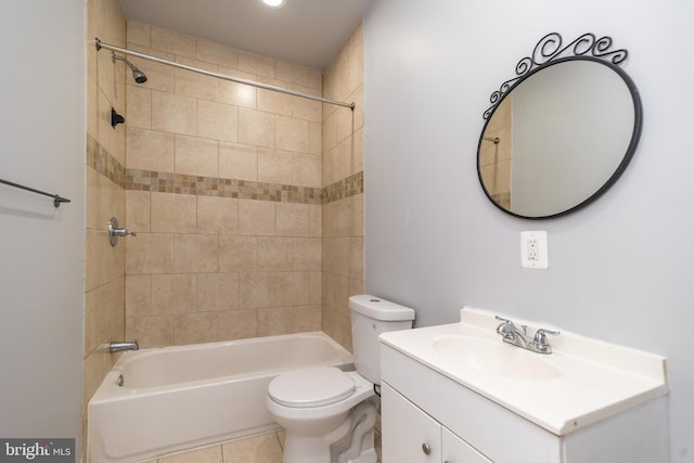 bathroom featuring tile patterned floors, shower / washtub combination, toilet, and vanity