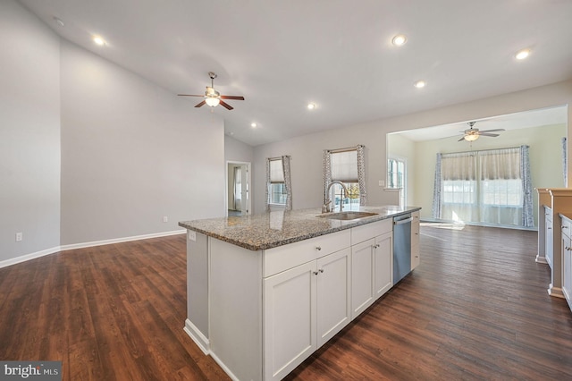 kitchen with dishwasher, open floor plan, and a ceiling fan