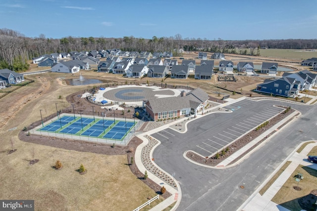 birds eye view of property with a residential view