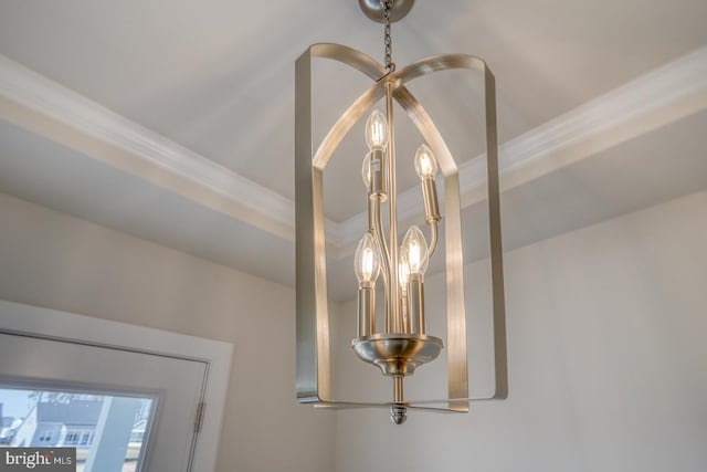 interior details featuring an inviting chandelier