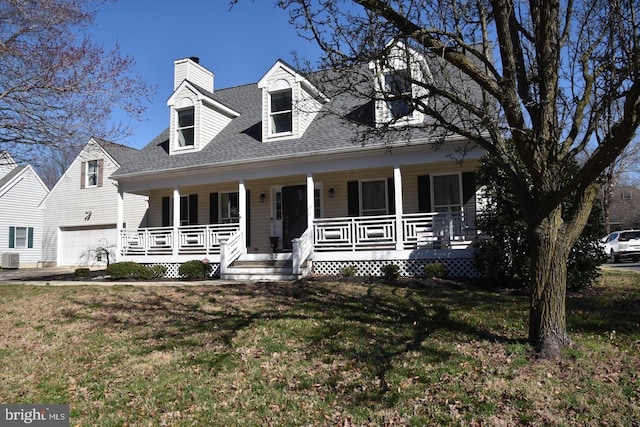 cape cod home with a front yard, roof with shingles, a porch, a chimney, and central air condition unit