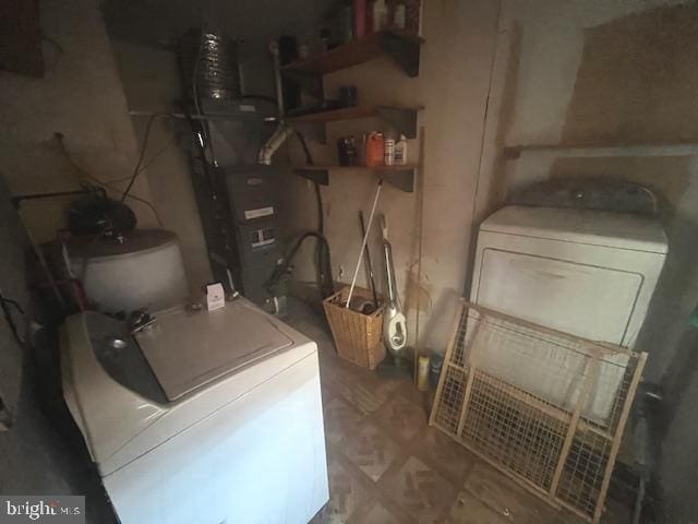 clothes washing area featuring laundry area and washing machine and clothes dryer