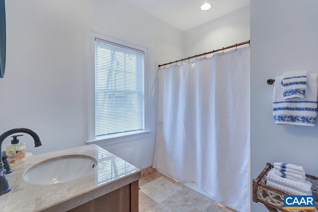 full bath with vanity, a shower with shower curtain, and tile patterned floors