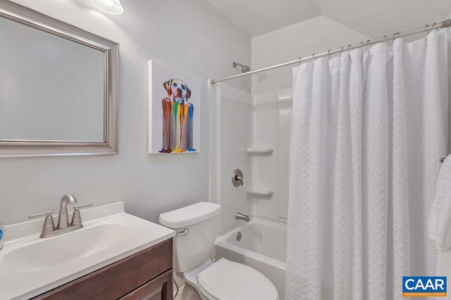 bathroom with shower / bath combo with shower curtain, toilet, and vanity