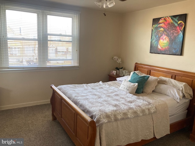 bedroom featuring baseboards and carpet floors