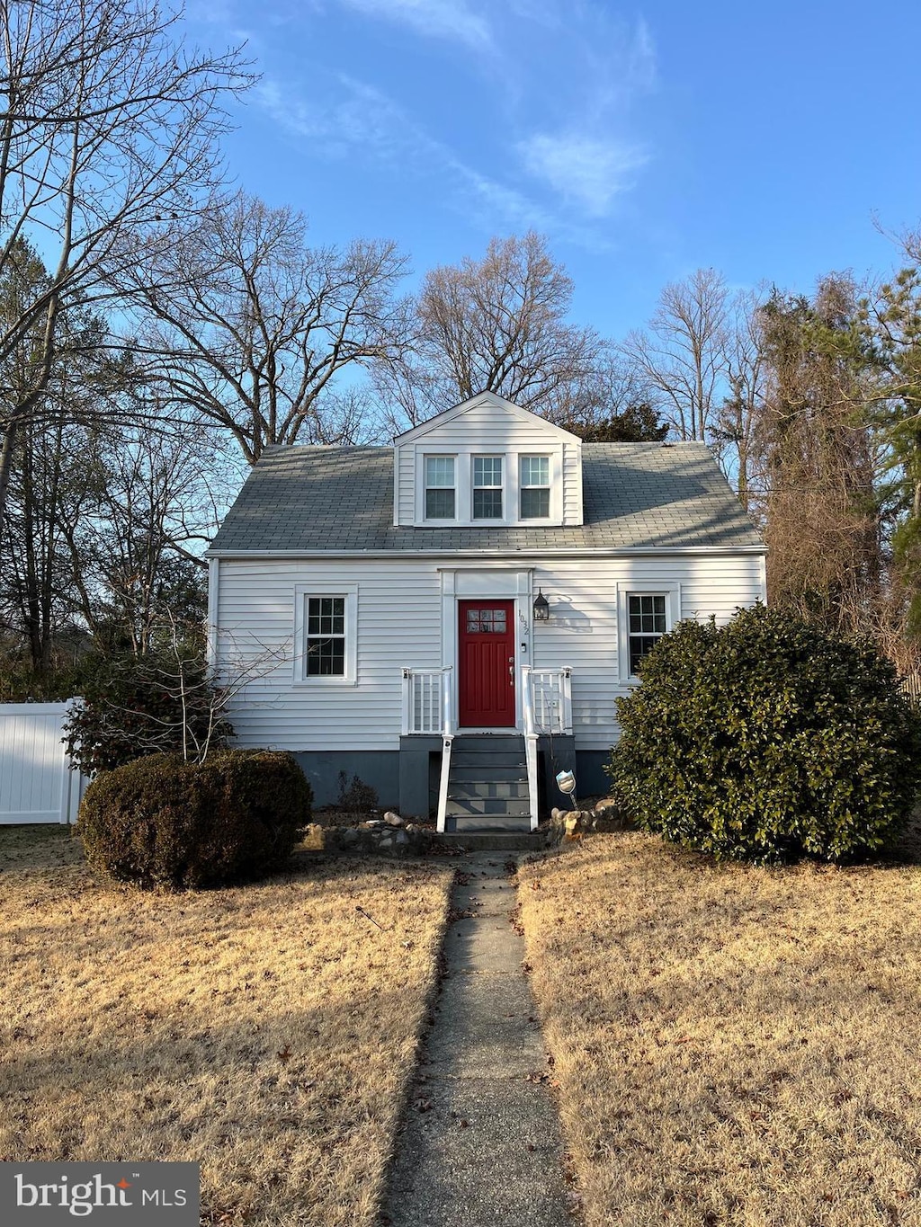 bungalow-style house with a shingled roof