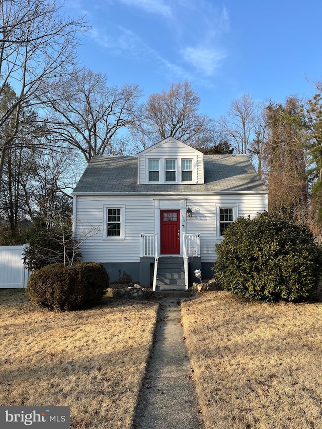 bungalow-style house with a shingled roof