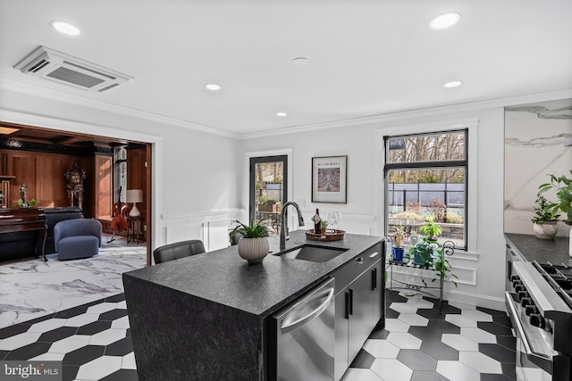 kitchen with a sink, visible vents, dark countertops, and appliances with stainless steel finishes