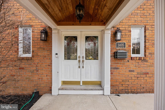 doorway to property with brick siding and french doors