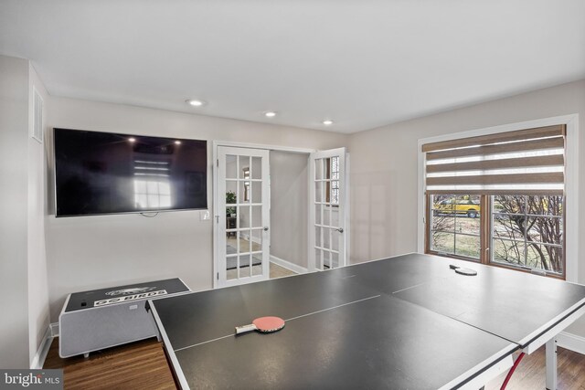 game room with dark wood finished floors, recessed lighting, french doors, and baseboards