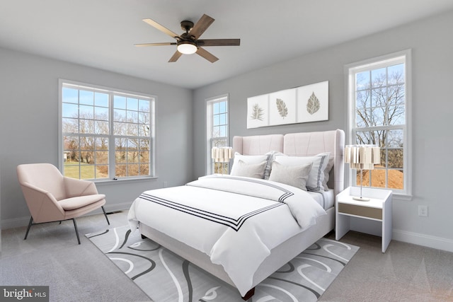 carpeted bedroom with baseboards