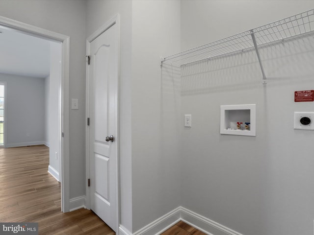 laundry room featuring hookup for an electric dryer, wood finished floors, baseboards, and washer hookup