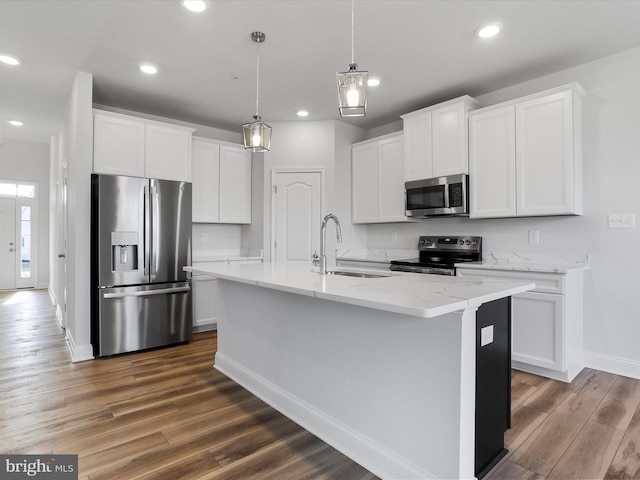 kitchen featuring recessed lighting, a sink, stainless steel appliances, dark wood-type flooring, and white cabinetry