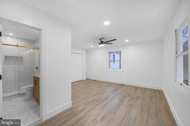 unfurnished bedroom with visible vents, baseboards, recessed lighting, a closet, and marble finish floor