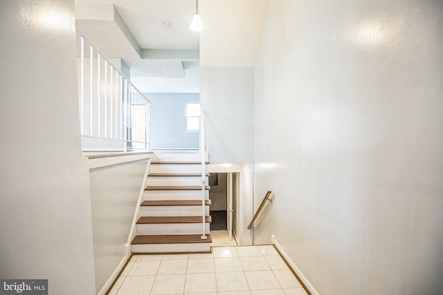 stairway featuring baseboards