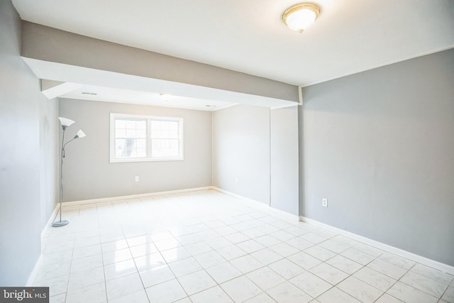 empty room with baseboards