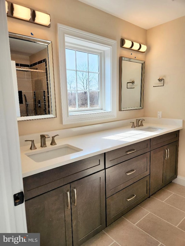 230 Banyan Dr, State College, PA 16801 - bathroom featuring tile patterned floors, double vanity, and a sink