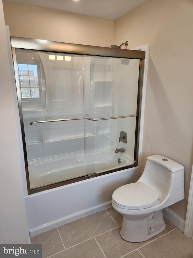 230 Banyan Dr, State College, PA 16801 - bathroom with combined bath / shower with glass door, toilet, and tile patterned flooring