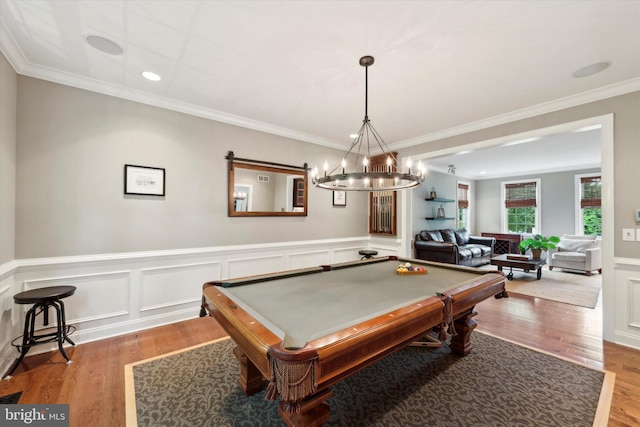 game room with billiards, wood finished floors, a wainscoted wall, crown molding, and a chandelier