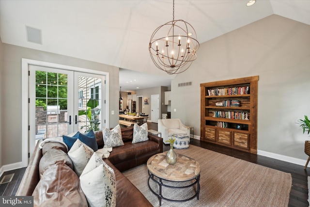 living area with a notable chandelier, visible vents, dark wood finished floors, and french doors