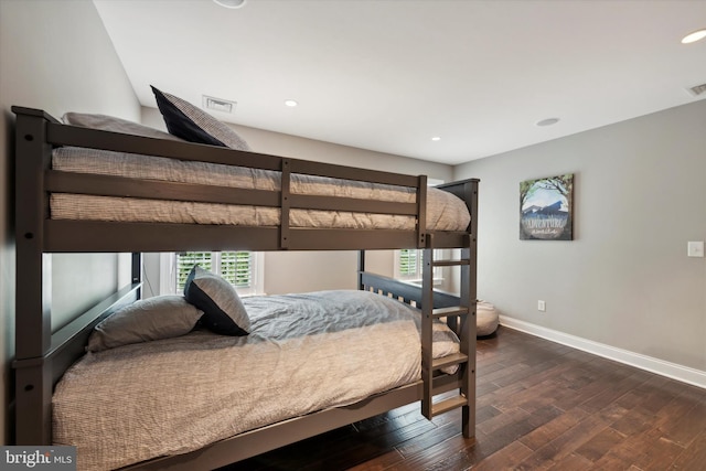 bedroom featuring dark wood finished floors, visible vents, recessed lighting, and baseboards