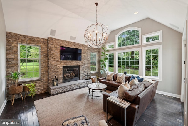 living area with high vaulted ceiling, a fireplace, baseboards, a chandelier, and dark wood-style flooring