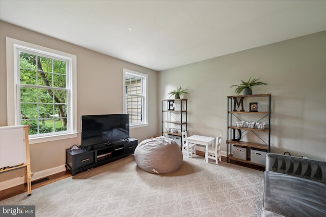 sitting room featuring visible vents and baseboards