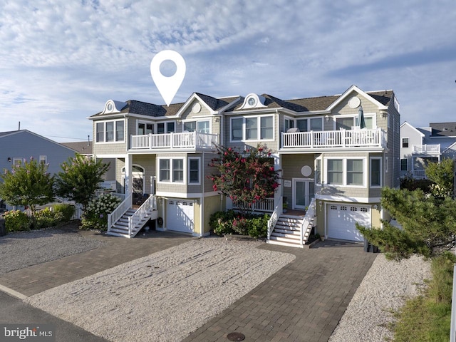 310 Kentford Ave E, Unit East, Beach Haven, NJ 08008 - view of front facade with a garage, decorative driveway, and a balcony