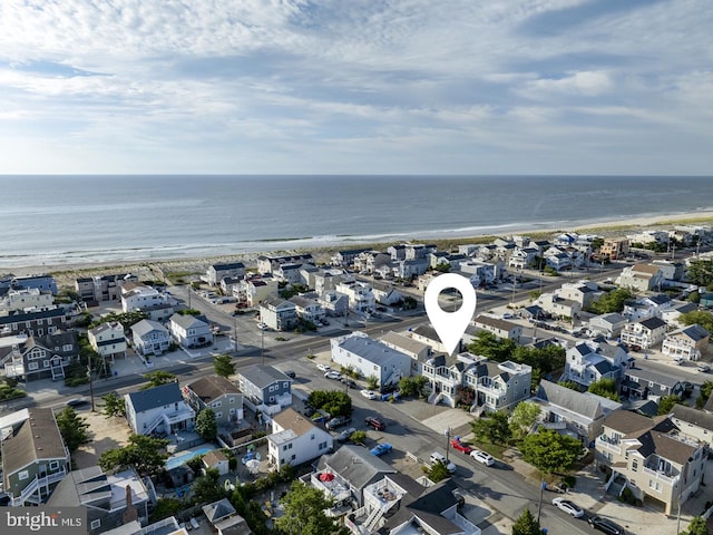 bird's eye view featuring a water view and a residential view