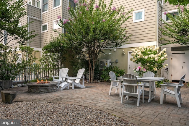 view of patio featuring a fire pit and outdoor dining space