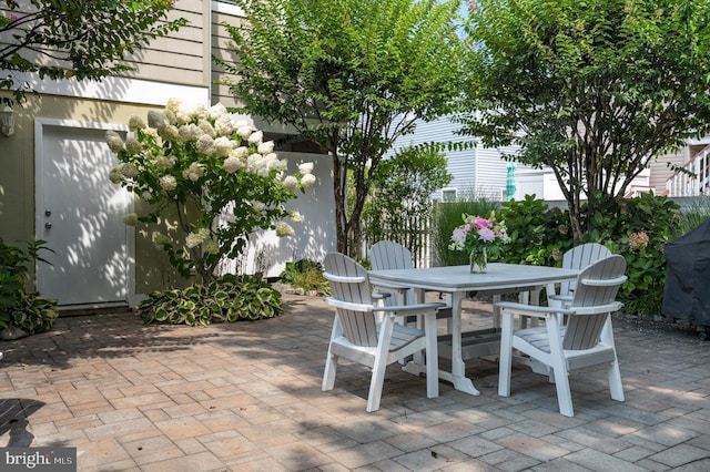 view of patio featuring outdoor dining area