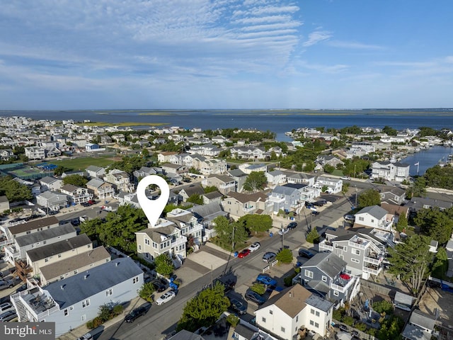 birds eye view of property featuring a water view and a residential view