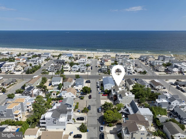 drone / aerial view featuring a residential view and a water view